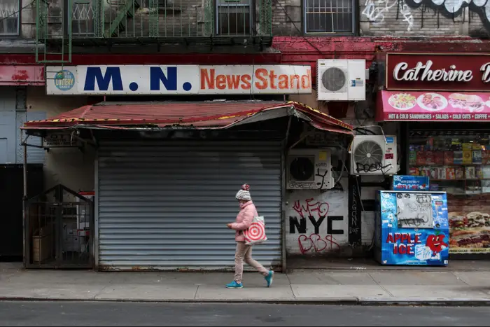 A photo of a woman walking on the Lower East Side